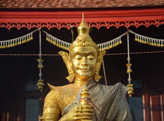 Thao Werasuwan gold color at Chulamani Temple, Samut Songkhram Province. Thailand