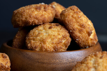 Delicious cookies with coconut on the table