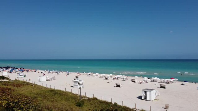 White sandy beaches of Miami Beach on a sunny day - aerial view