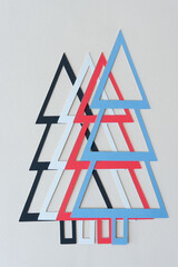 four holiday trees on blank paper
