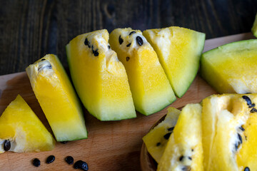 Ripe and juicy yellow watermelon cut into pieces