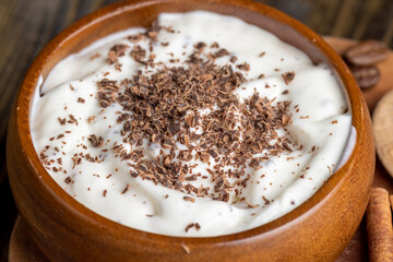 Yogurt made from cream with the addition of chocolate pieces and crumbs