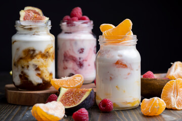Milk yogurt with tangerine, close up