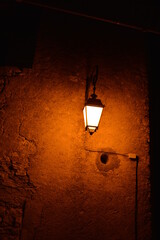 Closeup of a street lamp at night in a deserted street