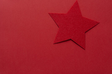 red flet star on red paper © eugen