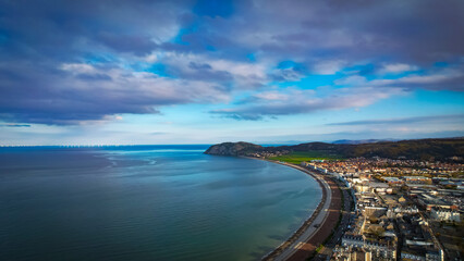 Llandudno, Wales. Aerial view over the seaside town with Victorian Pier and Irish Sea shore.
