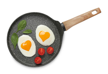 Frying pan with tasty fried eggs with yolks in shape of heart and tomato on white background, top view
