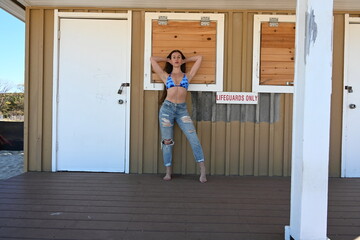 Fototapeta premium Beautiful young woman at the beach, in the park