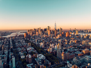 Sunrise above New York Lower Manhattan buildings. Clear sky, morning light
