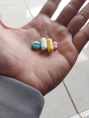 A Men hold  Pills in his hand. drags and medecine concept, Medecine Capsules , pill, health, prescription