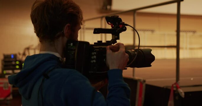 Behind the scenes how somebody is filming backstage with a cinema camera