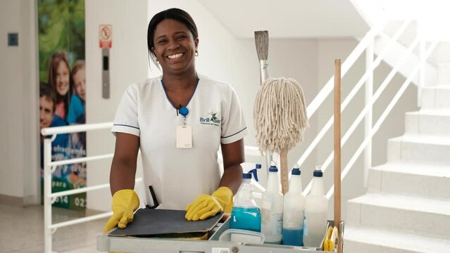 Cleaning lady smiling at work