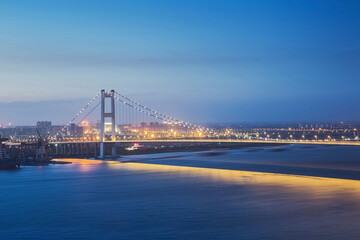 Obraz premium Yangtze River Bridge and Night View of the Yangtze River in Jiangyin City, Jiangsu Province, China