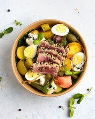 salad with tuna in a cardboard box