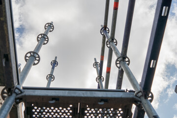 Metal scaffolding and wood building construction, building site