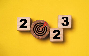 Top view of 2023 year and target board for setup new year business objective and goal concept.