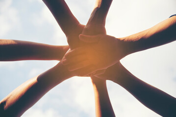 Group of young asian man and woman in holding hands for team work.