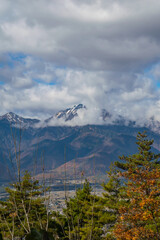 Landscape mountain with clouds and snow in autumn 