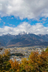 Landscape mountain with clouds and snow in autumn 