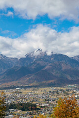 Landscape from the top of the mountain with clouds and snow