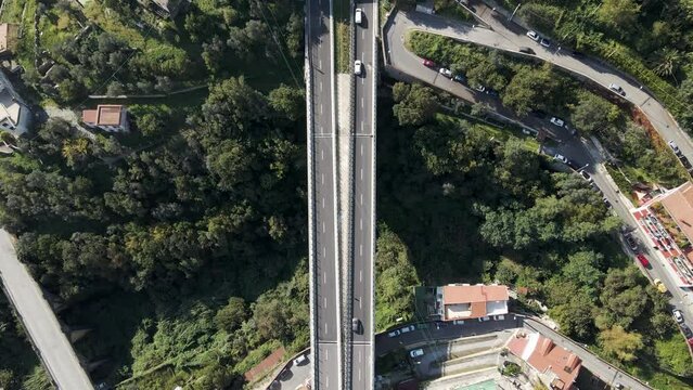 Aerial view of vehicles driving on the highway entering the tunnel in Salerno, Campania, Italy.