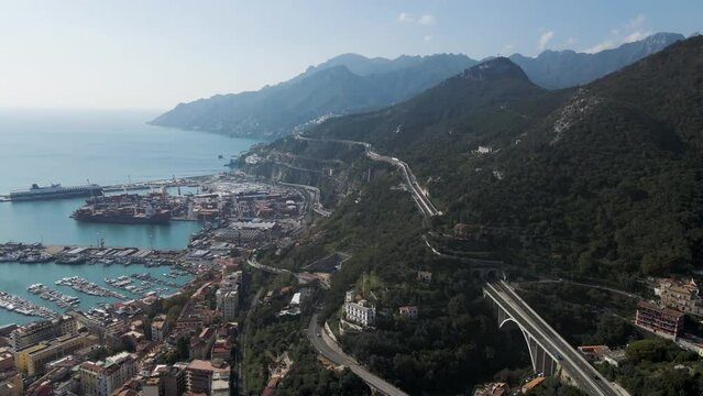 Aerial view of the highway along the coastline with mountains in Salerno, Campania, Italy.