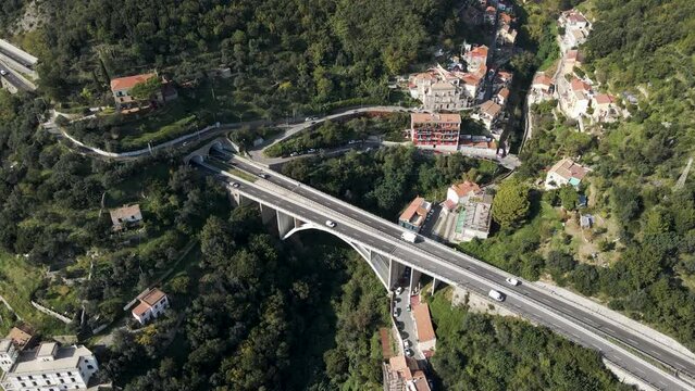 Aerial view of vehicles driving on the highway suspended bridge in Salerno, Campania, Italy.