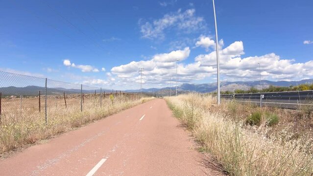 Camino de Madrid - Senda Real bicycle path along the M-607 highway next to Colmenar Viejo, Madrid, Spain - dolly