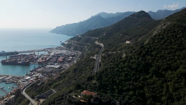 Aerial view of the highway along the coastline with mountains in Salerno, Campania, Italy.