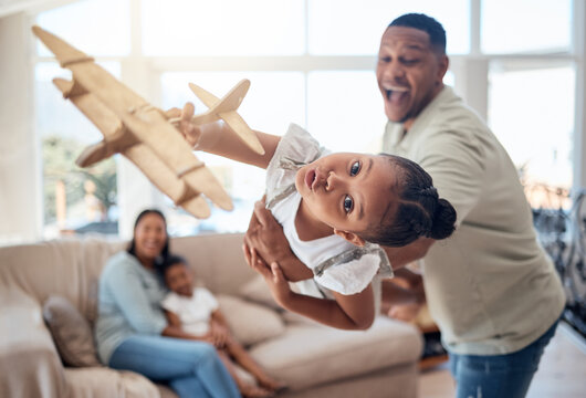 Father, girl or playing with toy airplane in family home or house living room for exciting game, travel dreams or fantasy. Playful portrait, plane or fun child bonding with man, dad or lifting parent