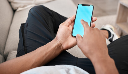 Man, hands or phone green screen mockup for advertising space, digital marketing media or internet esports ux. Blue screen, mock up or chroma key on mobile technology social media app in living room