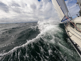 Sailboat fights storm and waves in open sea. Concept of travel, adventure, risk and adrenaline © Hladchenko Viktor