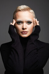 Short Hair Beautiful young woman with white snow brows. sensual blond girl with fancy makeup