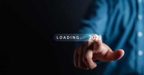 Businessman touching to virtual download bar and loading for New Year and changing year 2022 to...
