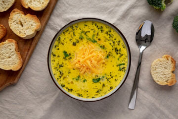 Homemade Broccoli and Cheddar Soup in a Bowl, top view. Flat lay, overhead, from above.