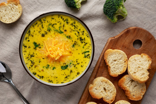 Homemade Broccoli and Cheddar Soup in a Bowl, top view. Flat lay, overhead, from above.