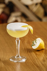 cocktail with lemon on table - obrazy, fototapety, plakaty