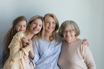 Loving multi-generational family portrait. Different age generation women, older and younger...
