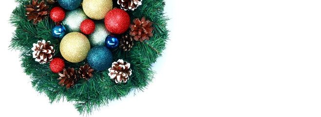 Christmas wreath with Christmas decorations inside on a white background. Artificial decor for the New Year. Christmas banner with empty space to add information
