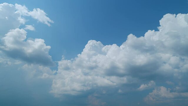 Cloud formation. Formation of a cumulonimbus cloud on a sunny day. Cumulus clouds in blue sky at border storm front. Timelapse.