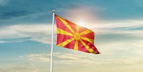 North Macedonia national flag cloth fabric waving on the sky - Image