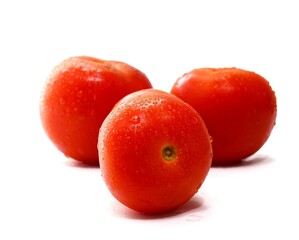 Red ripe tomato with water drops isolated on white background, Solanum lycopersicum