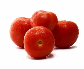 Red ripe tomato with water drops isolated on white background, Solanum lycopersicum