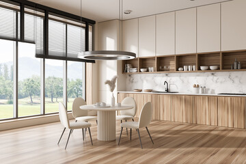 Fototapeta na wymiar Corner view on bright kitchen room interior with dining table