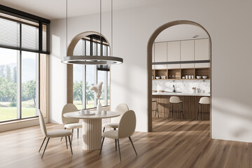 Light kitchen interior with eating area and window, cooking area and kitchenware
