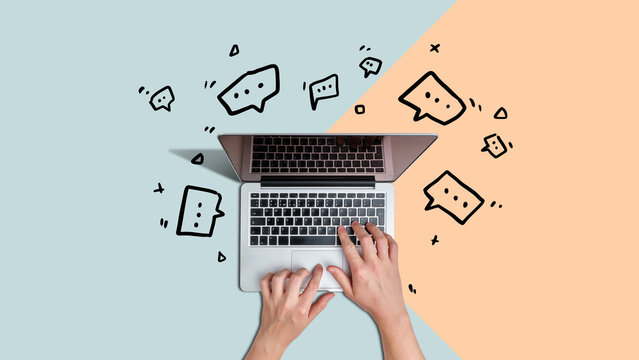 Real-time computer network messaging facility. Person chatting using laptop with icons beside