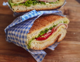 Italian ciabatta bread sandwich with rucola , tomatoes and  prosciutto  crudo