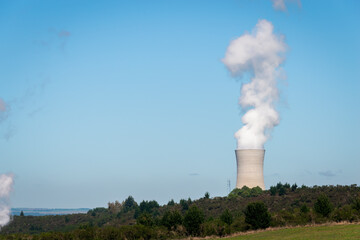 Industrial chimney with heavy white smoke causing air pollution