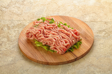 Raw minced pork meat over board