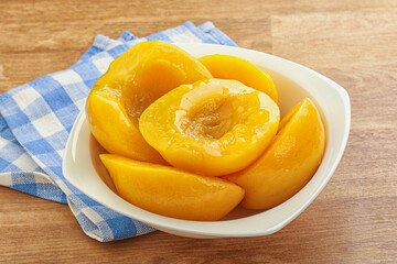 Sweet canned peaches with syrope